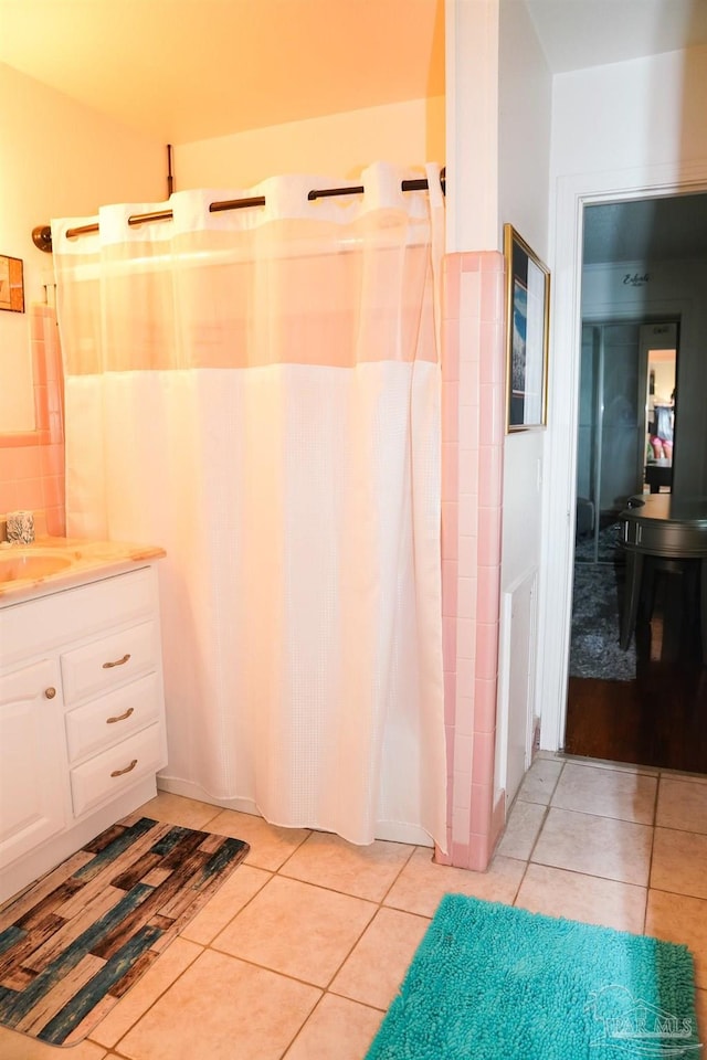 bathroom with vanity, a shower with curtain, and tile patterned floors