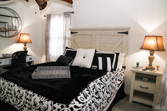 carpeted bedroom with ceiling fan