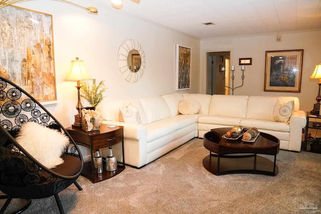 carpeted living room with ornamental molding