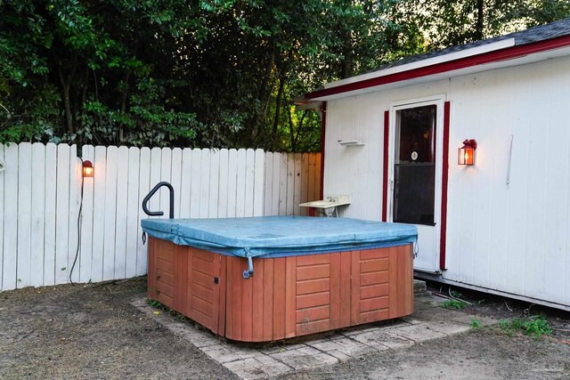 view of patio / terrace with a hot tub