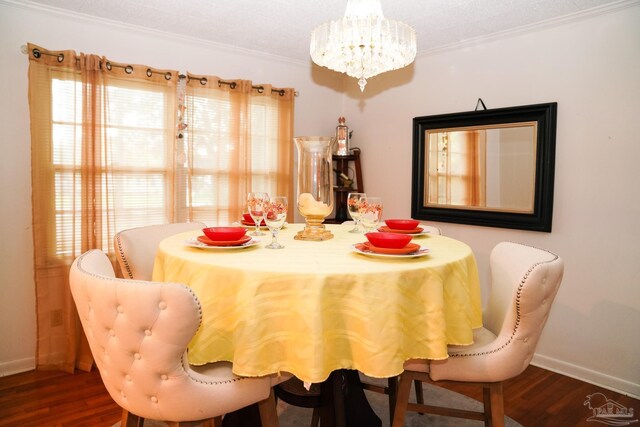 dining space with dark wood-type flooring, crown molding, a textured ceiling, and a chandelier