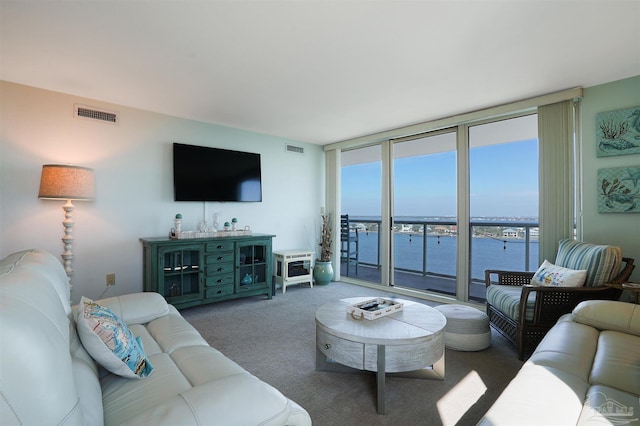 330FORT Pickens Rd Unit 11C, Pensacola Beach, FL 32561 - carpeted living area featuring expansive windows and visible vents