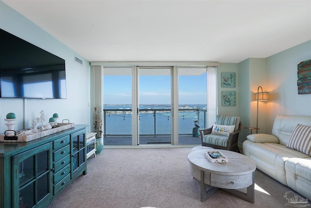 330FORT Pickens Rd Unit 11C, Pensacola Beach, FL 32561 - carpeted living room featuring visible vents and floor to ceiling windows