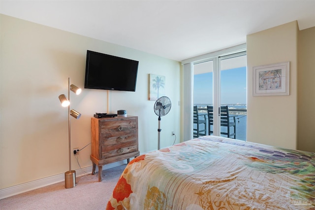 330FORT Pickens Rd Unit 11C, Pensacola Beach, FL 32561 - bedroom featuring access to outside, carpet flooring, and baseboards