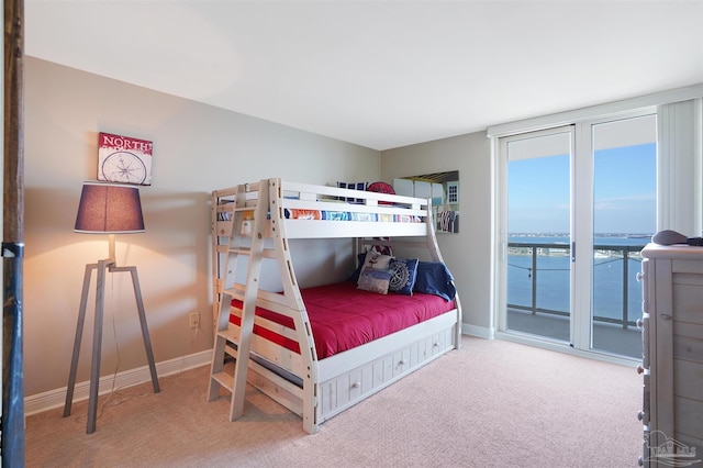 330FORT Pickens Rd Unit 11C, Pensacola Beach, FL 32561 - carpeted bedroom featuring access to exterior, a water view, and baseboards