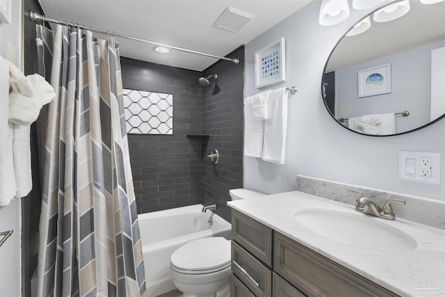 full bathroom featuring toilet, shower / bath combination with curtain, and vanity