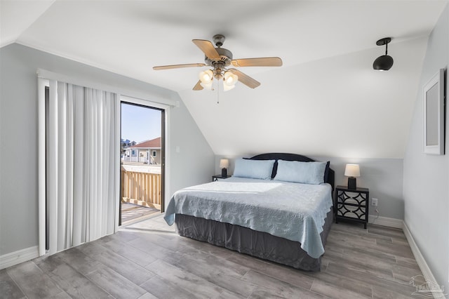 bedroom with access to outside, ceiling fan, vaulted ceiling, and wood-type flooring