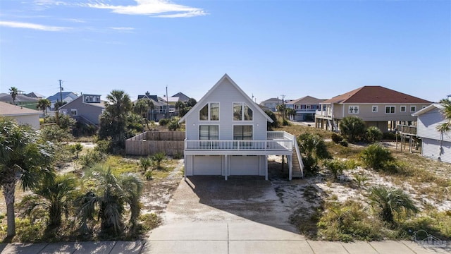 rear view of property featuring a garage