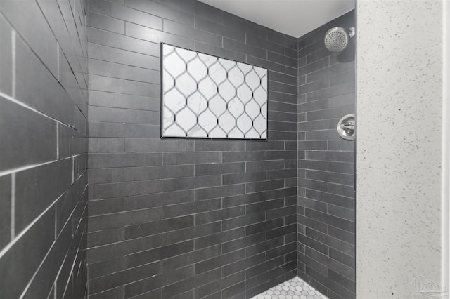 bathroom with a tile shower