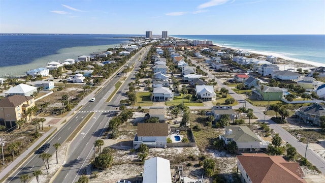 bird's eye view featuring a view of the beach and a water view