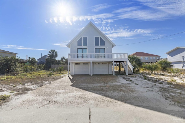 view of front of property with a balcony and a garage