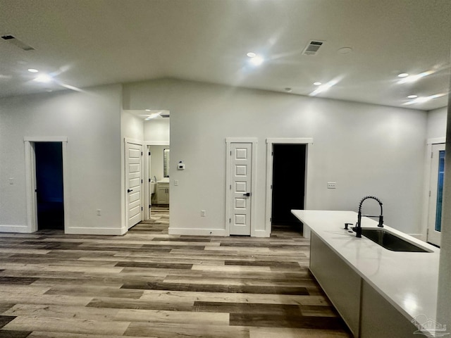 2020 Talbert St, Pensacola, FL 32507 - kitchen with a sink, wood finished floors, lofted ceiling, baseboards, and recessed lighting