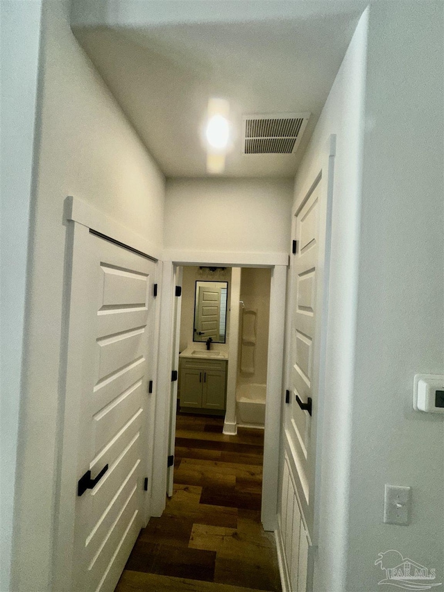 2020 Talbert St, Pensacola, FL 32507 - hall with a sink and dark wood finished floors