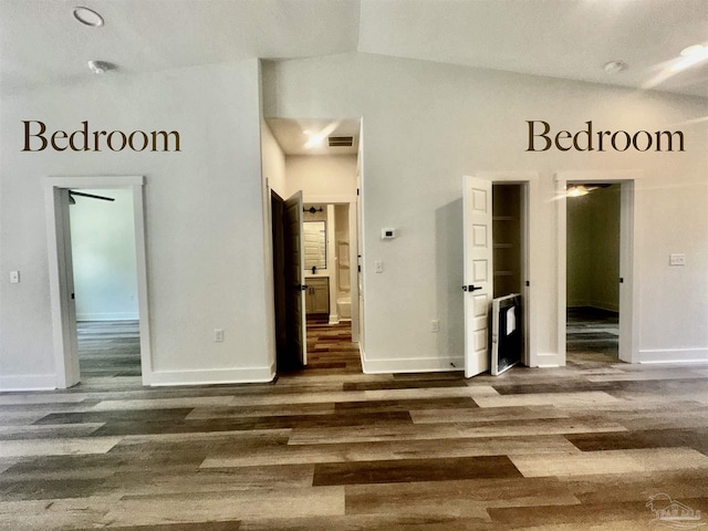 2020 Talbert St, Pensacola, FL 32507 - unfurnished room with wood finished floors, lofted ceiling, and baseboards