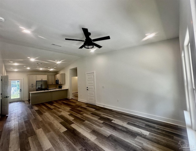 2020 Talbert St, Pensacola, FL 32507 - unfurnished living room featuring dark wood finished floors, baseboards, lofted ceiling, ceiling fan, and recessed lighting
