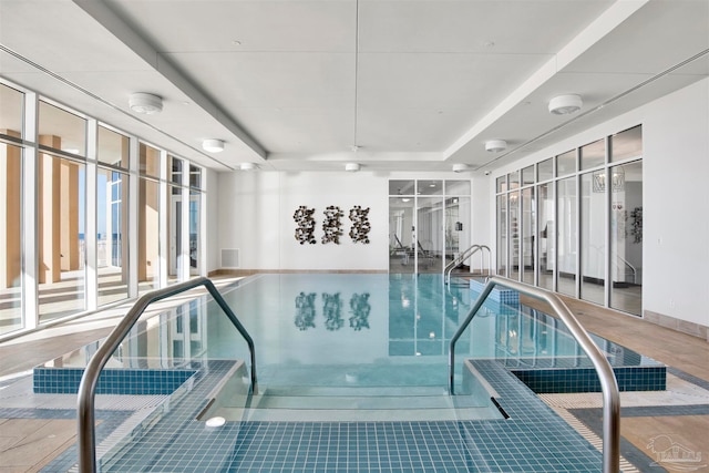 view of pool with a jacuzzi