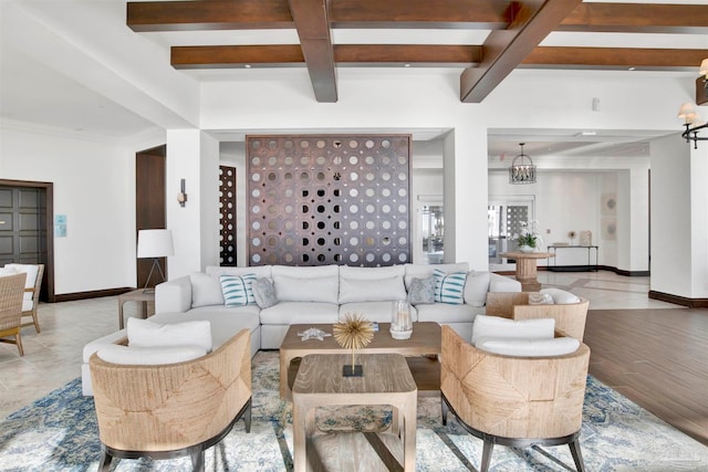 living room with light hardwood / wood-style floors and beamed ceiling