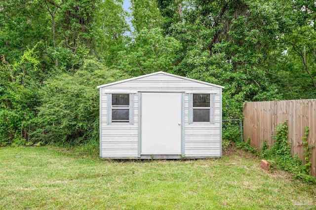 view of shed with fence