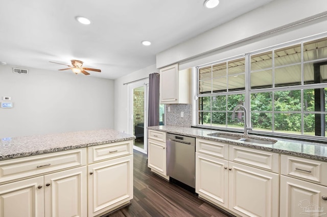 kitchen with visible vents, decorative backsplash, dishwasher, dark wood-type flooring, and a sink