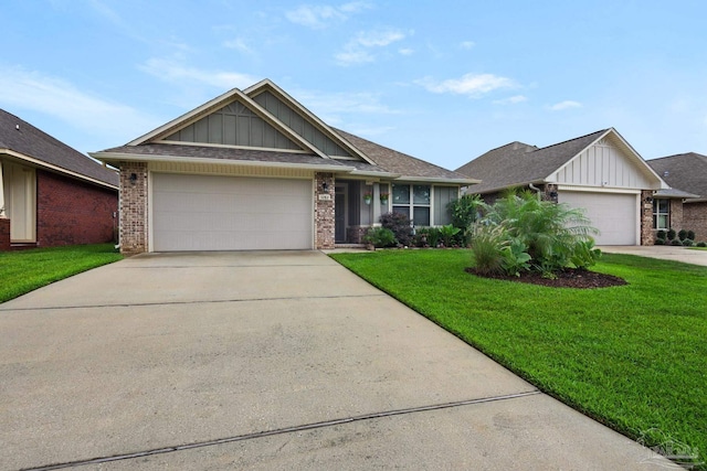 5282 Parkside Dr, Pace, FL 32571 - view of front of house with board and batten siding, brick siding, and an attached garage