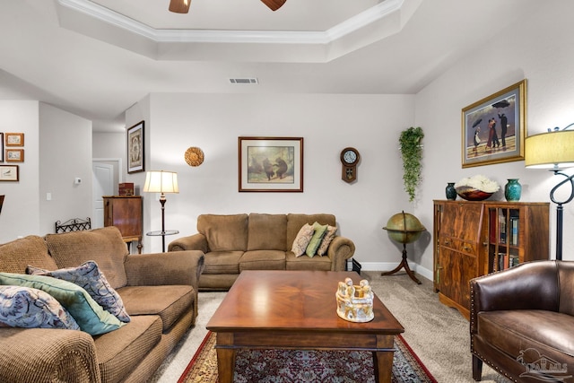 5282 Parkside Dr, Pace, FL 32571 - carpeted living room with a tray ceiling, ceiling fan, and crown molding