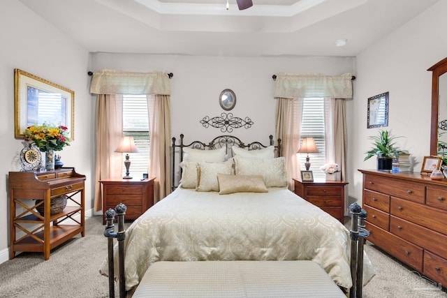5282 Parkside Dr, Pace, FL 32571 - bedroom with light carpet, multiple windows, a tray ceiling, and ceiling fan