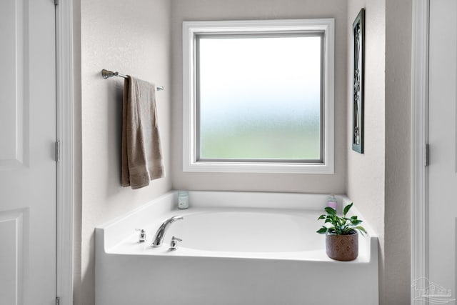 5282 Parkside Dr, Pace, FL 32571 - bathroom featuring plenty of natural light and a garden tub