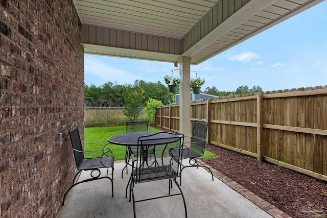 5282 Parkside Dr, Pace, FL 32571 - fenced backyard featuring outdoor dining space and a patio area