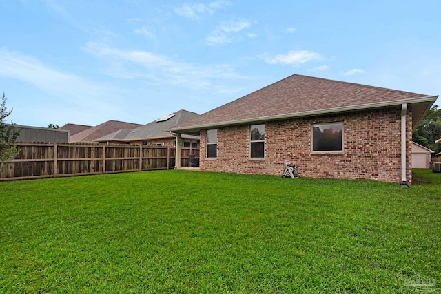 5282 Parkside Dr, Pace, FL 32571 - back of house featuring brick siding and a shingled roof