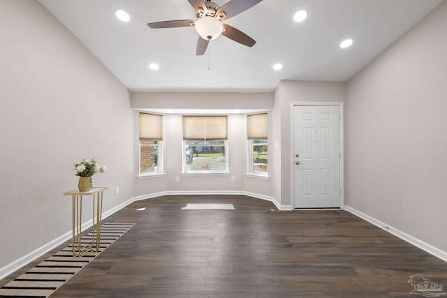 interior space featuring ceiling fan and dark hardwood / wood-style flooring