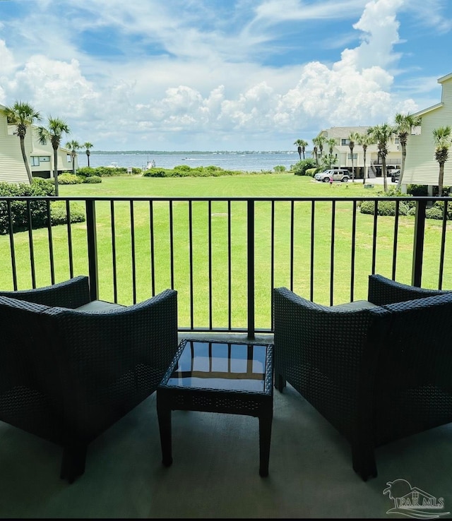 balcony featuring a water view