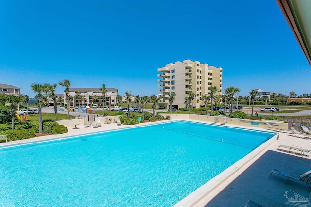 view of swimming pool featuring a patio