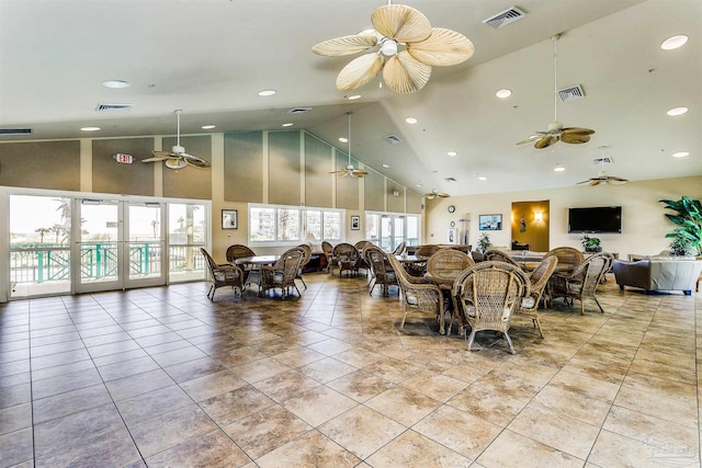 tiled dining space with french doors, high vaulted ceiling, and ceiling fan