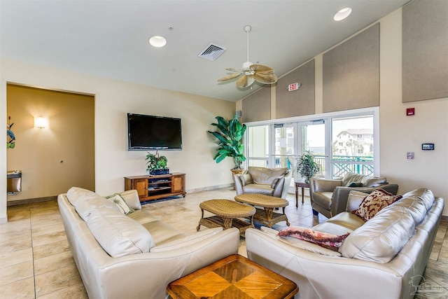 tiled living room featuring high vaulted ceiling and ceiling fan