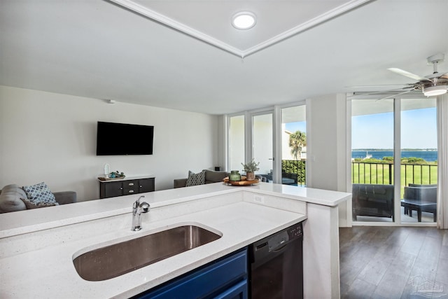 kitchen with light stone counters, sink, dark hardwood / wood-style flooring, black dishwasher, and blue cabinets