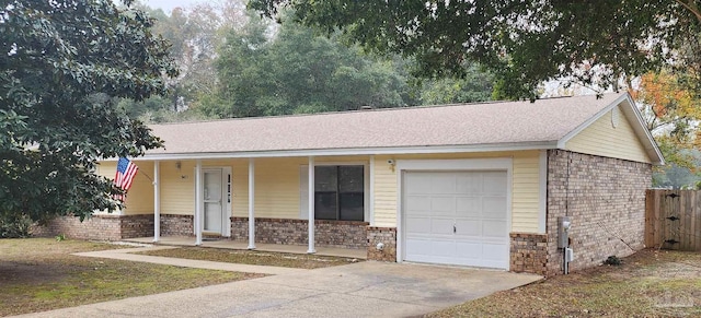 ranch-style home with covered porch and a garage