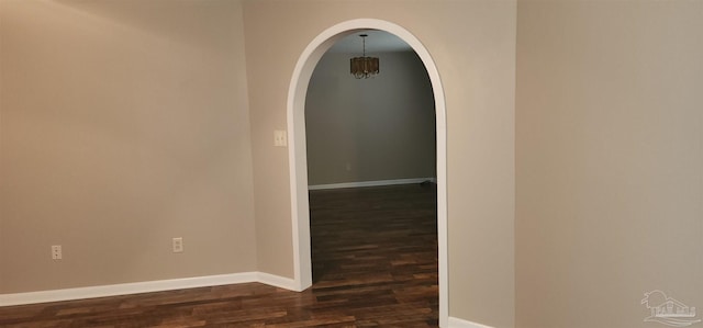 hall with dark hardwood / wood-style flooring