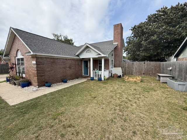 1515 Mariners Cir, Gulf Breeze, FL 32563 - ranch-style house with brick siding, a chimney, and a shingled roof