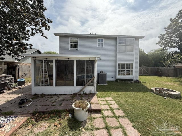 1515 Mariners Cir, Gulf Breeze, FL 32563 - back of house featuring an outdoor fire pit, a sunroom, central AC unit, and a patio