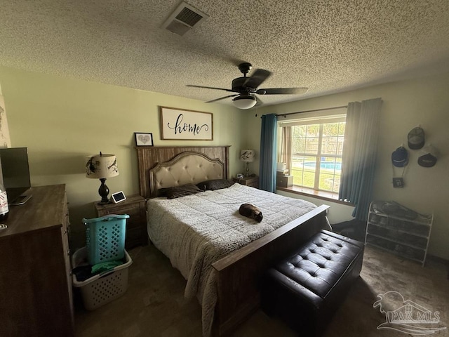 1515 Mariners Cir, Gulf Breeze, FL 32563 - bedroom featuring carpet floors, a textured ceiling, and ceiling fan