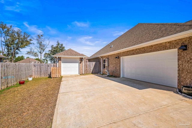 single story home featuring driveway, a garage, roof with shingles, fence, and brick siding