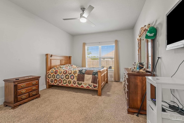 bedroom featuring a ceiling fan and light colored carpet