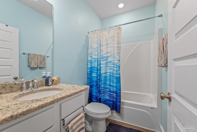 bathroom with shower / tub combo with curtain, vanity, and toilet