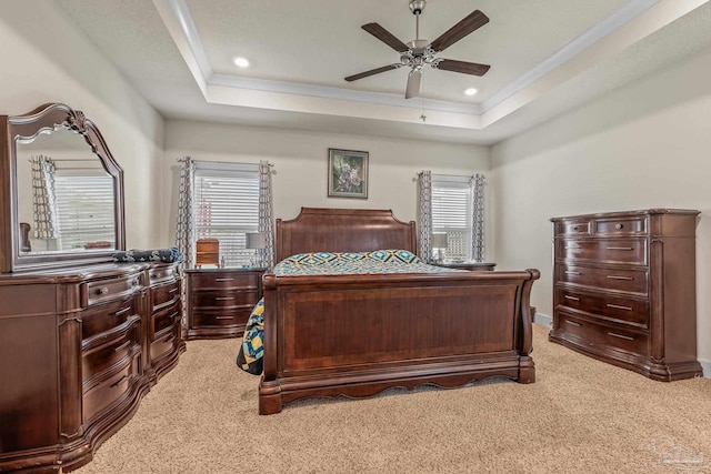 bedroom with ceiling fan, recessed lighting, a raised ceiling, and light colored carpet