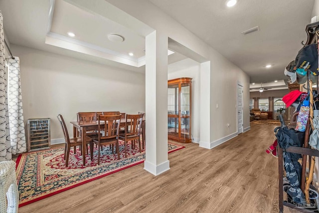 dining room with baseboards, visible vents, a ceiling fan, wood finished floors, and recessed lighting