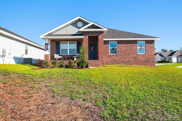 view of front of home featuring central air condition unit and a front lawn