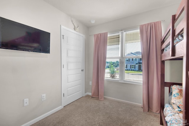 unfurnished bedroom with carpet floors