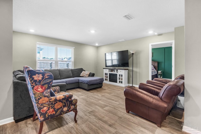 living room with light hardwood / wood-style flooring