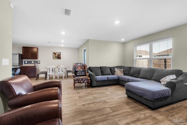 living room with light hardwood / wood-style flooring