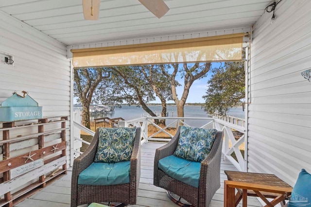 wooden deck featuring a water view